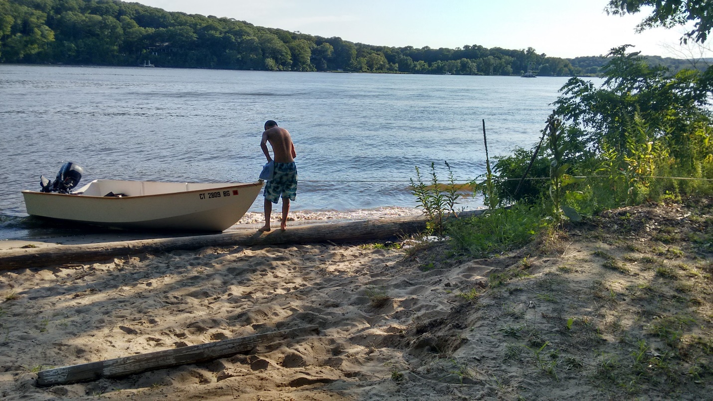 Boat beached at a lakeside campsite