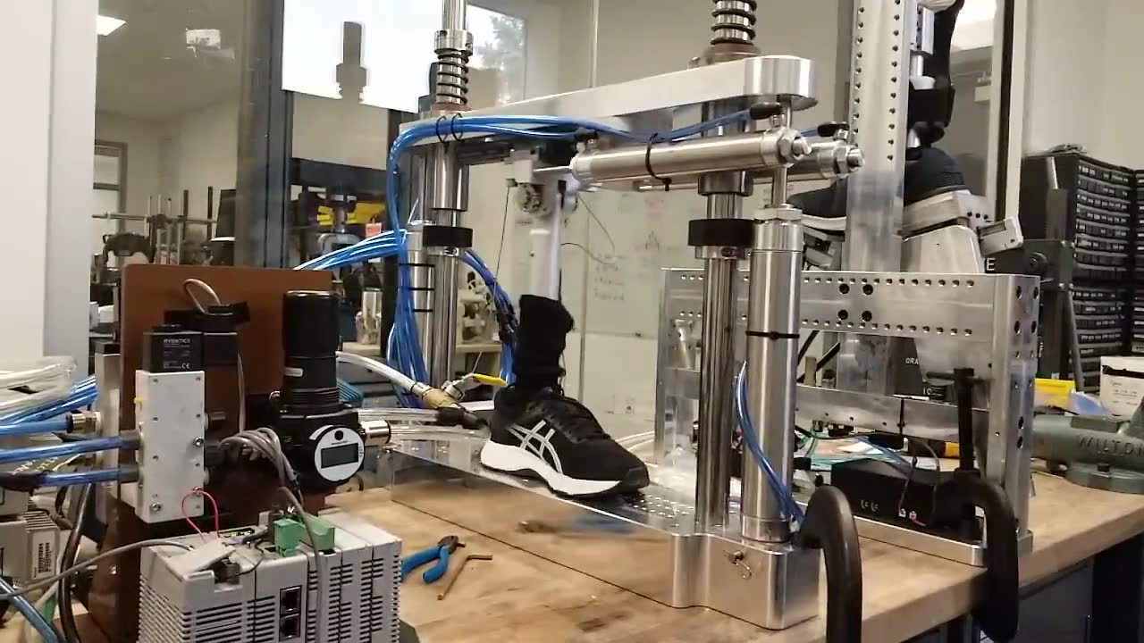 Gait load replication fixture actuating a shoe on a sock-and-last fixture
